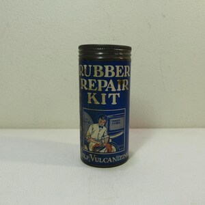 Recipiente con kit de reparación de caucho vintage con contenido parcial
