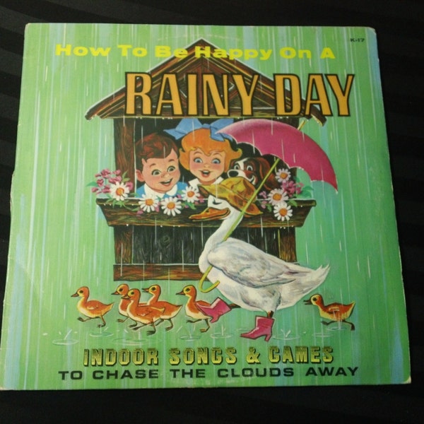How To Be Happy On A Rainy Day: Indoor Songs & Games To Chase The Clouds Away - K 17 - 12" vinyl lp, album (Peter Rabbit Records,196?)