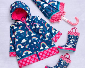 May include: A blue raincoat with a rainbow and cloud print, pink trim, and a zipper closure. The raincoat is paired with matching blue rain boots with pink trim.