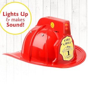 May include: Red plastic firefighter helmet with a yellow "Fire Chief" badge and a red flashing light. The helmet lights up and makes sounds.