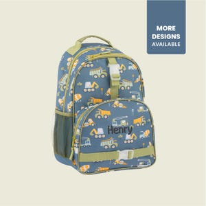 May include: Blue backpack with a construction vehicle pattern, featuring dump trucks, excavators, and cement mixers. The name "Henry" is embroidered on the front. The backpack has green accents, a side mesh pocket, and the text "MORE DESIGNS AVAILABLE".