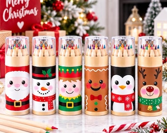 May include: Six cylindrical containers filled with colored pencils, each featuring a different holiday character design: Santa Claus, a snowman, an elf, a gingerbread person, a penguin, and a reindeer. The containers have clear plastic lids.