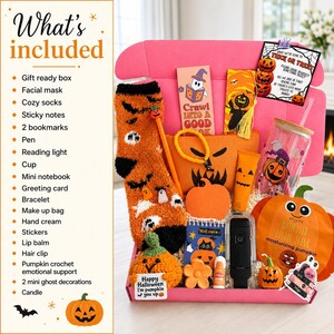 May include: A pink gift box filled with Halloween-themed items including orange fuzzy socks, a pumpkin-shaped crochet plush, a glass cup, a facial mask, a makeup bag, a reading light, bookmarks, a pen, lip balm, a hair clip, and a greeting card.