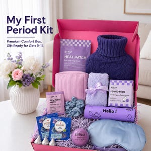 May include: A pink gift box containing a dark purple cable-knit hot water bottle cover, a lavender heat patch, a pink pouch, a light purple fuzzy towel, a pack of organic cotton period pads, a lavender bath bomb, a blue sleep mask, and tea bags.