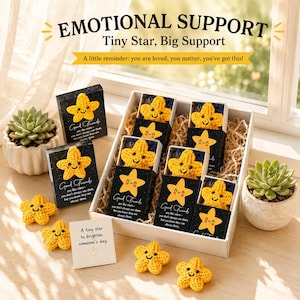 May include: A box set of yellow crocheted star-shaped gifts with smiling faces. The box contains several stars in individual black boxes with the text "Good Friends". The image also includes the text "EMOTIONAL SUPPORT" and "Tiny Star, Big Support".