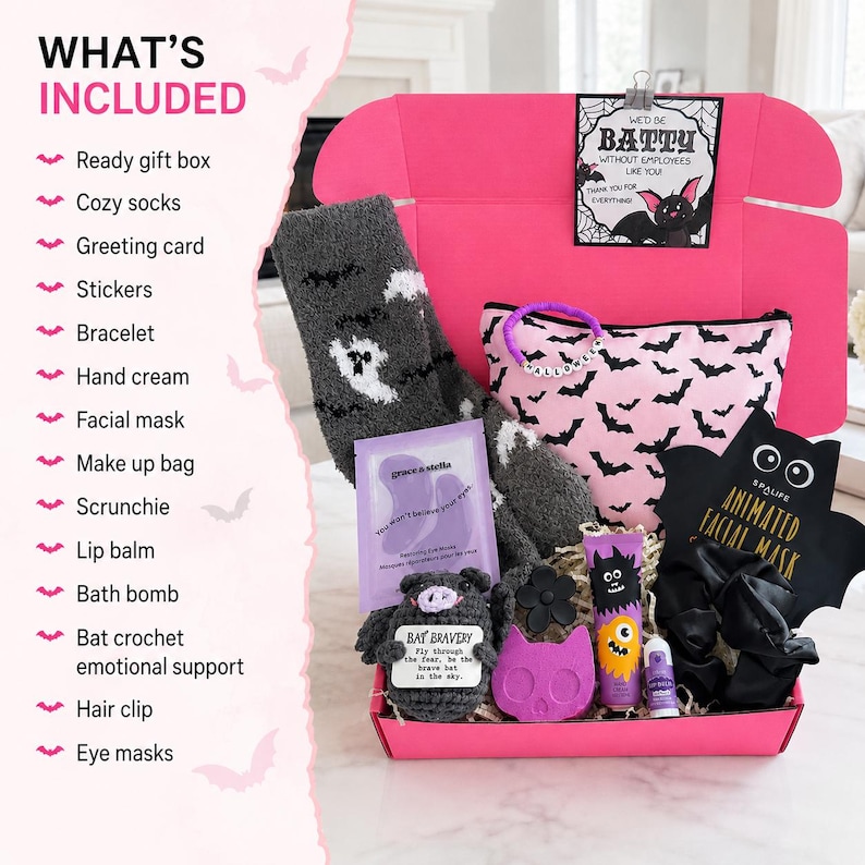 May include: A pink gift box containing gray fuzzy socks with ghost patterns, a pink makeup bag with black bats, a crochet bat, a black bat-shaped facial mask, a purple eye mask packet, a black scrunchie, a purple bath bomb, lip balm, and a bracelet.