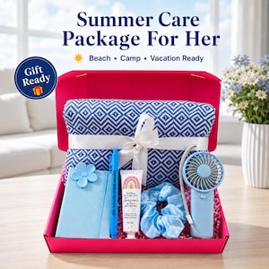 May include: A bright pink gift box containing a blue and white diamond-patterned blanket tied with a white ribbon, a light blue notebook with a flower accent, a blue pen, a tube of body lotion, a light blue scrunchie, and a handheld fan.