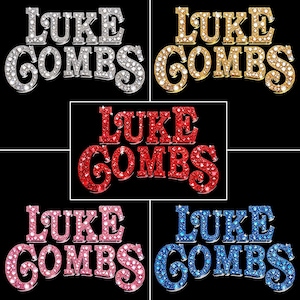 May include: Five variations of the name "LUKE COMBS" in a bold, sparkling font. The colour variations include silver, gold, red, pink, and blue, all set against a black background. The letters are embellished with glitter.