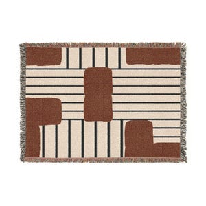 May include: A rectangular woven throw blanket with a geometric design. The blanket features a cream-colored background with horizontal black stripes and brown rectangular shapes. The edges are fringed.