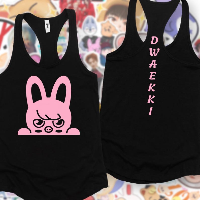 May include: Black vest top featuring a pink bunny graphic with a grumpy face. The back of the vest top displays the word "DWAEKKI" in pink, printed vertically. A relaxed, comfortable top suitable for casual wear.