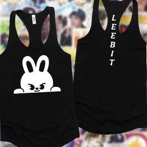 May include: Black racerback vest with a white cartoon bunny graphic on the front. The back of the vest has the word "LEEBIT" printed vertically in white. The vest is made of a soft material.