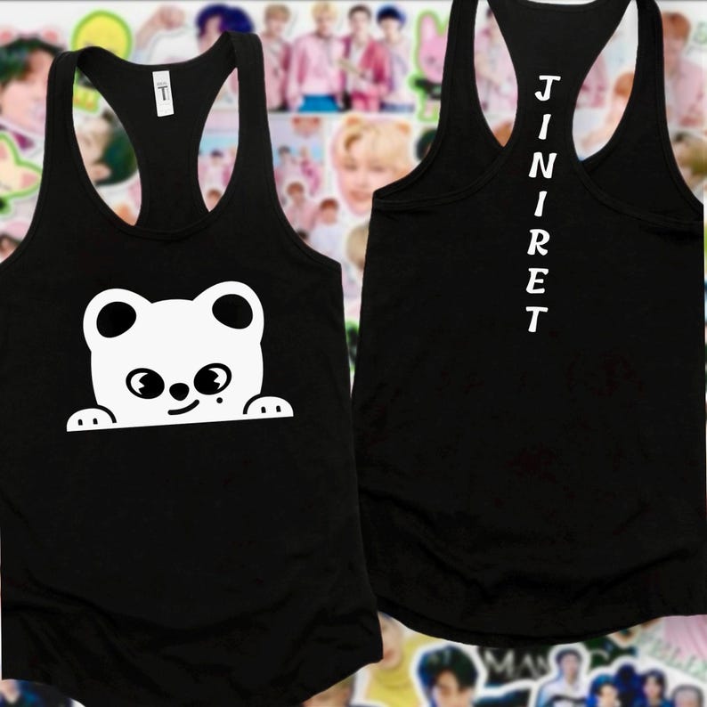 May include: Black vest top featuring a white cartoon bear design on the front. The bear has large eyes and is peeking over a line. The back of the vest top has the word "JINRET" printed vertically in white.