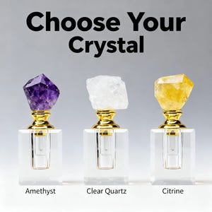 May include: Three crystal perfume bottles with gold accents and clear glass bases. The crystals are amethyst, clear quartz, and citrine. The text "Choose Your Crystal" is at the top, with the crystal names below each bottle.