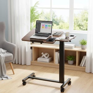 May include: A brown and black adjustable laptop desk with wheels. The desk has a laptop, mouse, and a cup of coffee on it. The desk is in front of a window with a view of trees and a chair.