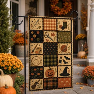 May include: A rectangular garden flag featuring a patchwork design of craft and autumn-themed illustrations, including a needle, scissors, buttons, a pumpkin, a witch hat, and a broomstick, all set against a black, orange, and green background.