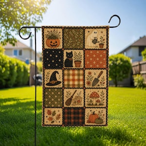 May include: A rectangular garden flag featuring a patchwork design of fifteen squares with autumn and Halloween motifs, including a jack-o'-lantern, a black cat, a ghost, a witch hat, a broom, mushrooms, pumpkins, and foliage on a metal stand.