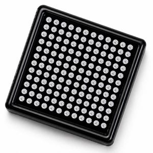 May include: A square black display case containing a grid of one hundred small, round, clear faceted stones arranged in ten rows and ten columns. The stones are set against a solid black background within a glossy black frame with rounded corners.