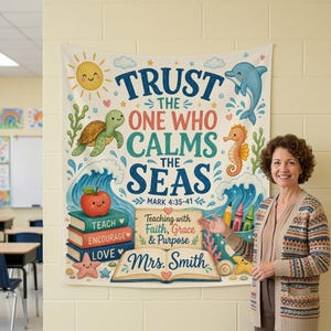 May include: A rectangular wall tapestry featuring the text TRUST THE ONE WHO CALMS THE SEAS MARK 4:35-41. The design includes a smiling sun, a sea turtle, a dolphin, a seahorse, waves, a stack of books, and an open book labeled Mrs. Smith.
