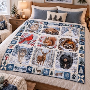 May include: A quilt featuring a grid of nine panels depicting winter wildlife including an owl, bear, rabbit, cardinal, squirrel, raccoon, wolf, deer, and black bear. The border displays snowflakes, pine trees, and paw prints in blue and white.