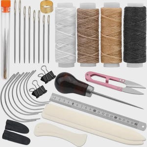 May include: A leathercrafting kit with various tools and supplies. Includes needles, thread spools in white, brown, tan, and black, a thimble, scissors, a ruler, and other tools. The kit is designed for leatherwork and crafting.