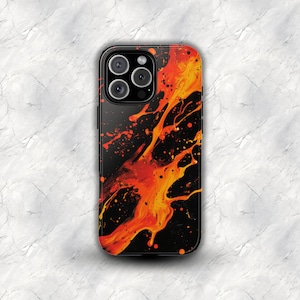 May include: A smartphone case featuring a black background with a vibrant orange and red paint splatter design. The pattern consists of fluid, abstract streaks and small droplets that extend across the surface, contrasting with the dark base.
