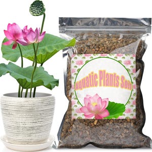 May include: A white ceramic pot with horizontal gray lines containing a pink lotus plant with green leaves and a seed pod, next to a clear plastic bag filled with brown granular substrate labeled Aquatic Plants Soil with a pink lotus graphic.