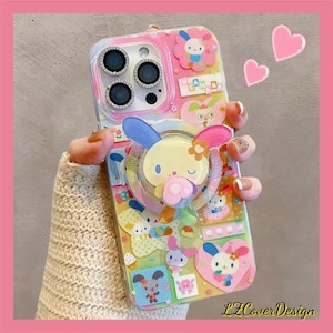 May include: A decorative phone case with cartoon characters and a pink border. The case features a pop-up bunny, flowers, and hearts. The text "LZCoverDesign" is visible on the case.