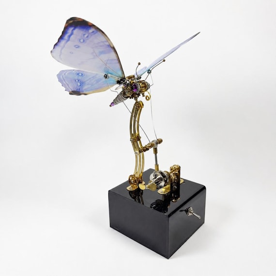 A handcrafted steampunk butterfly automaton with genuinely moving wings — this is the kind of mechanical art piece that looks like it escaped from a Victorian inventor's workshop.