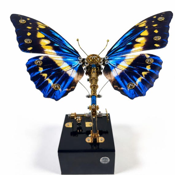 A hand-assembled mechanical butterfly automata with genuinely flapping wings — part desk sculpture, part engineering puzzle.