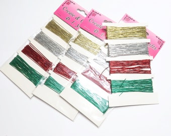 May include: Assortment of metallic craft cords in gold, silver, red, and green. The cords are packaged in clear plastic bags with white labels that read "Create & Craft D.I.Y."