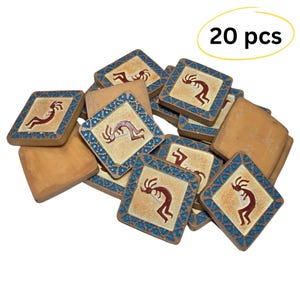 May include: A collection of 20 square tiles with a Kokopelli design. Each tile features a tan background with a red Kokopelli figure, surrounded by a blue mosaic border. The plain wooden tiles are also visible.