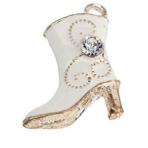 May include: White ceramic boot charm with a gold trim and a clear rhinestone. The boot has a delicate floral design.