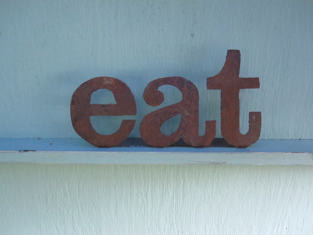 Metal eat Sign on Stand. Great for a Rustic or Etsy