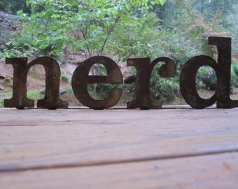 Metal "nerd" on stand
