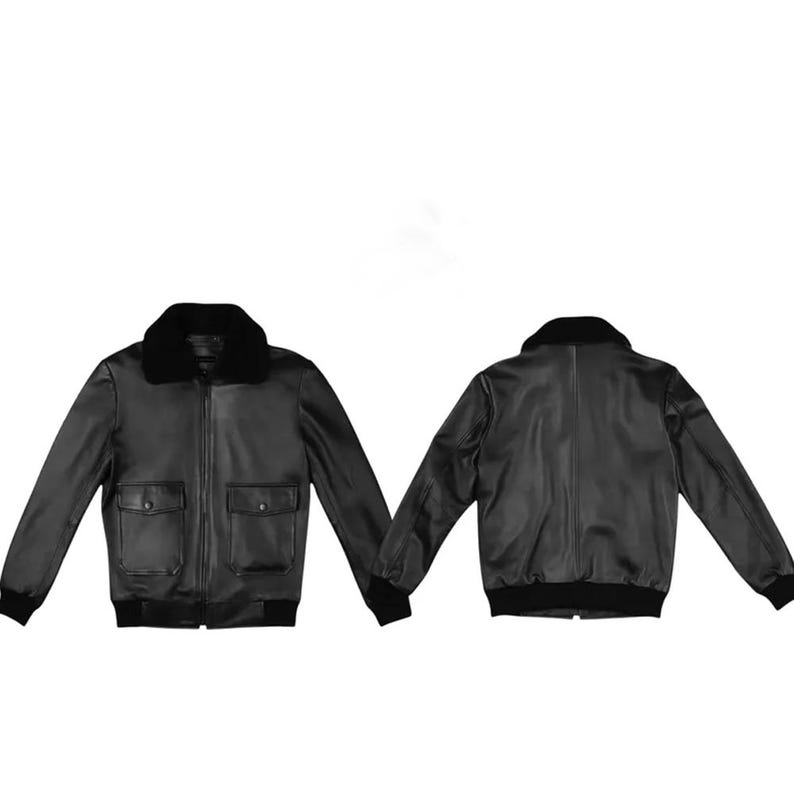 Black leather bomber jacket for men with faux fur collar, front zipper closure, ribbed cuffs, and classic aviator style design on white background.