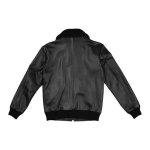Black leather bomber jacket for men with faux fur collar, front zipper closure, ribbed cuffs, and classic aviator style design on white background.