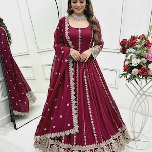 May include: A set of three ceramic mugs with a speckled, matte finish. The mugs are in shades of cream, light gray, and dark gray. Each mug has a simple, minimalist design, perfect for coffee or tea.