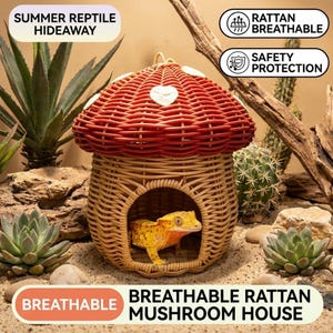 May include: A woven rattan mushroom house with a red cap and white accents. The house has a round opening and a gecko inside. The text on the image says "Summer reptile hideaway" and "Breathable rattan mushroom house".