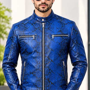 May include: A vibrant blue leather jacket featuring a black snakeskin pattern, a stand-up collar with a snap button, a full-length silver front zipper, and two horizontal zippered chest pockets along with two lower zippered pockets.