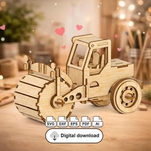 May include: A wooden model of a road roller, featuring a large front roller, a cab, and rear wheels. The model is made of light-colored wood and has intricate details. The image includes the text "Digital download" and file type icons.