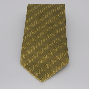 May include: Olive green necktie with a repeating, stylized, yellow, wave-like pattern. The tie is angled, showing its full length and design. The background is plain white.