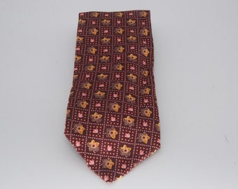 May include: A brown silk tie with a repeating pattern of pink and gold flowers.
