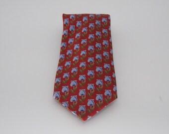 May include: A red silk tie with a pattern of blue flowers.