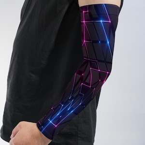 May include: An arm sleeve featuring a dark geometric pattern with glowing blue and magenta lines. The design consists of interconnected polygons and sharp angles that create a futuristic aesthetic across the entire length of the fabric sleeve.