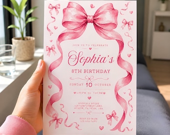 May include: A rectangular birthday invitation card featuring a large watercolor pink bow at the top with trailing ribbons, smaller bows, and hearts. The text reads: Join us to celebrate Sophia's 8th Birthday, Sunday 10 October, 4:00 PM to 7:00 PM, at 128 Sunflower Lane, Austin, TX 78704, USA.