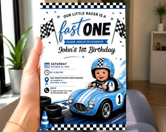 May include: A rectangular birthday invitation card featuring a blue race car with a baby driver wearing a helmet. The text reads Our Little Racer Is A Fast One, John's 1st Birthday, Saturday October 26, 2026, at 2:00 PM, The Sweethouse Restaurant, 123 Marion St, Oak Park, IL 12345, and RSVP to Andy at 000-123-4567 or email@email.com.