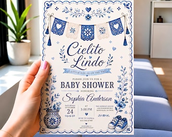 May include: A rectangular baby shower invitation card featuring a blue and white floral border, a banner with hanging pennants, and the text Cielito Lindo, A Little Boy Is On The Way, Baby Shower, Sophia Anderson, October 24, 3:00 PM, and location details.