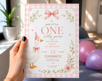 May include: A rectangular birthday invitation card with a pink and white gingham border. It features a watercolor illustration of a goose wearing a party hat and bow tie, pink floral accents, a large pink bow, and text reading Our Little One.