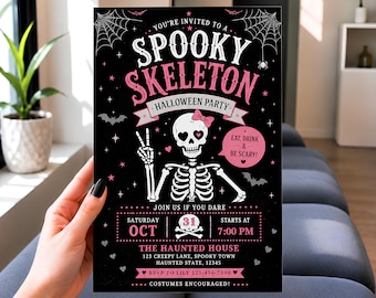May include: A rectangular Halloween party invitation card with a black background, featuring a white skeleton graphic with a pink bow, heart-shaped eyes, and a peace sign. The text reads: YOU'RE INVITED TO A SPOOKY SKELETON HALLOWEEN PARTY, EAT, DRINK & BE SCARY, SATURDAY OCT 31, 7:00 PM, THE HAUNTED HOUSE, 123 CREEPY LANE, SPOOKY TOWN, HAUNTED STATE, 12345, RSVP TO LILY 123-456-7890, COSTUMES ENCOURAGED.