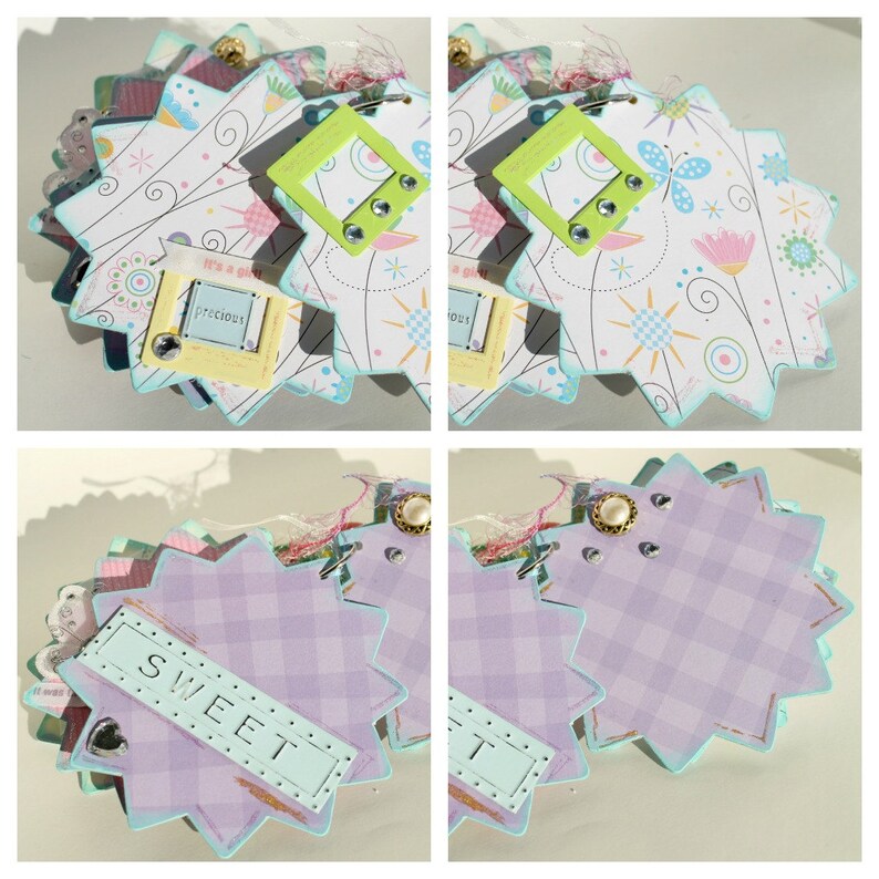 May include: A scrapbook with a light blue, pink, and white color scheme. The scrapbook has a starburst shape and features a variety of decorative elements, including flowers, butterflies, and stars. The scrapbook also includes a small tag with the word "precious" written on it.